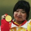 Guo Wenjun oro en pistola a diez metros