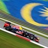 Vettel baila bajo la lluvia
